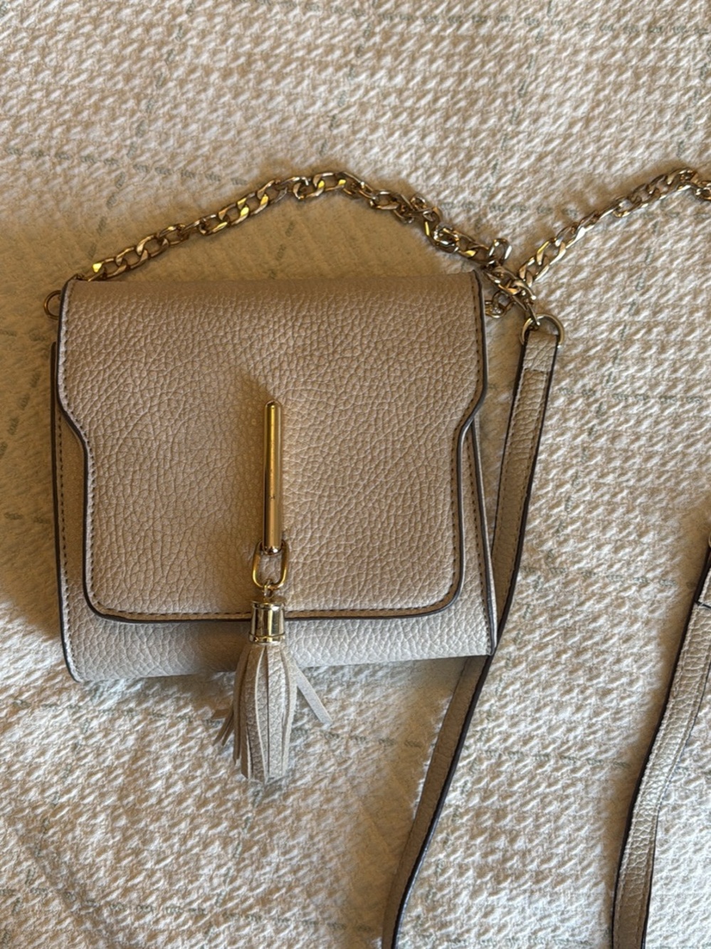 Melie Biiano Cream Crossbody with Gold Chain and Tassel Accent